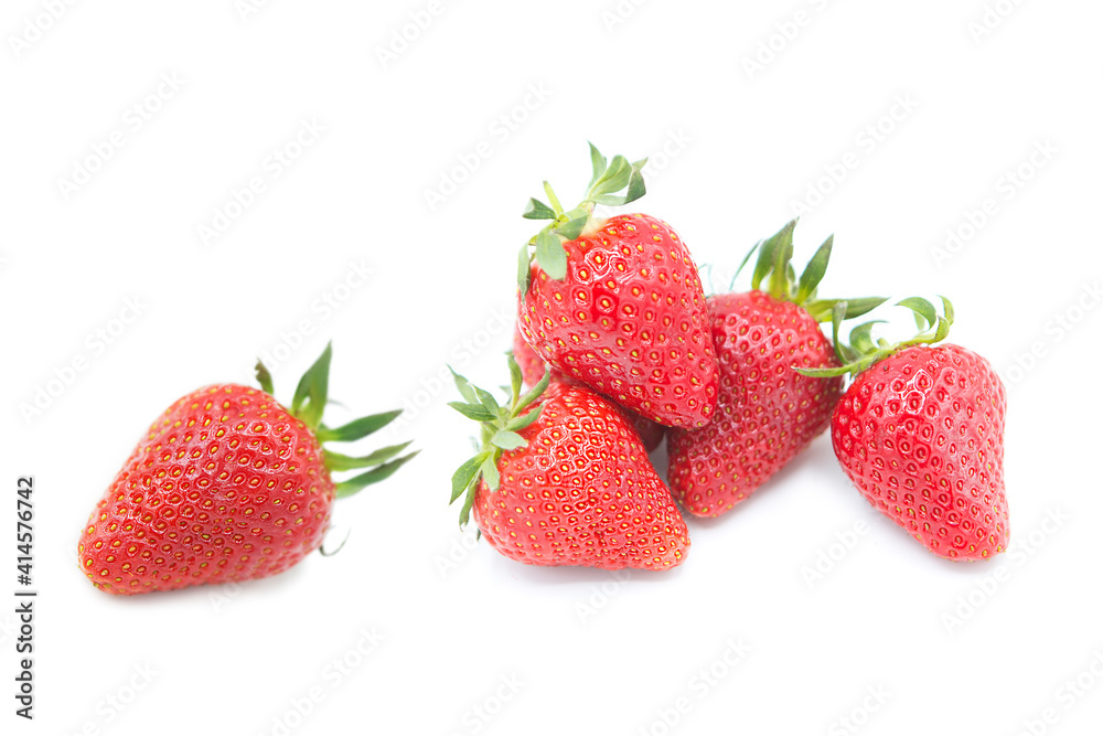 Ripe fresh organic strawberries in a pile and whole with leaves isolated on white background. Ripe fresh organic strawberries in a pile and whole with leaves isolated on white background.