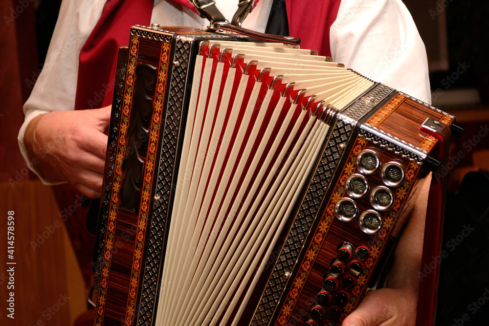 Man In Costume Plays On A Styrian Harmonica