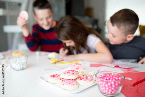 kids writing valentine's day cards