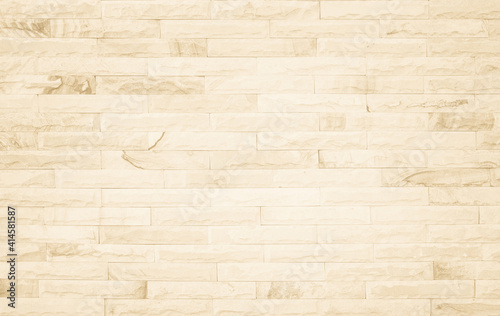 Empty background of wide cream brick wall texture. Beige old brown brick wall concrete or stone textured, wallpaper limestone abstract flooring/Grid uneven interior rock. Home decor design backdrop.