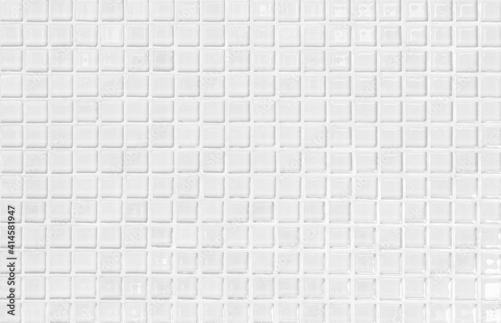 White or gray ceramic wall and floor tiles abstract background. Design geometric mosaic texture decoration of the bedroom. Simple seamless pattern for backdrop hospital wall, canteen and grid paper.