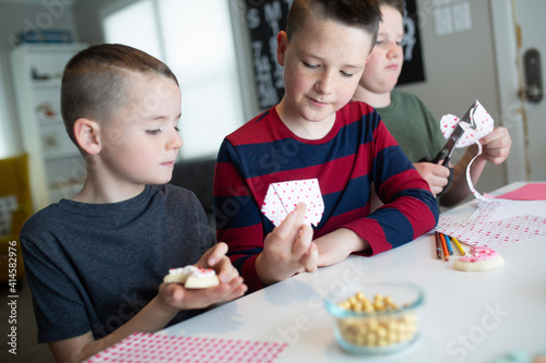 kids writing valentine's day cards