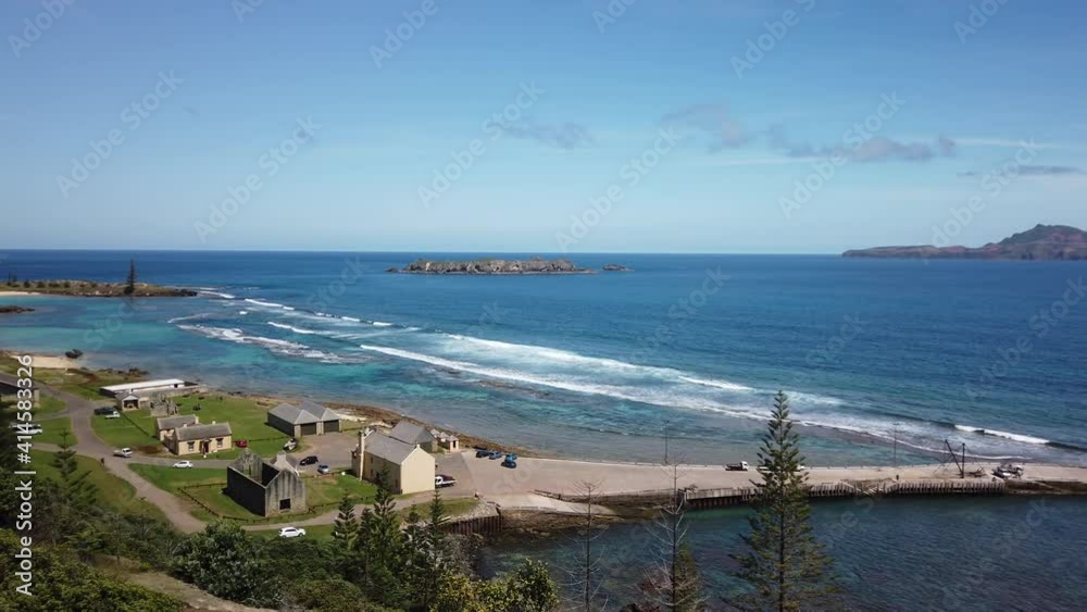 Left to right panning motion of old historic buildings and Kingston Pier of the unesco world heritage site of Kingston, viewed from Flagstaff Hill, Kingston, Norfolk Island, Australian Left to right panning motion of old historic buildings and Kingston Pier of the unesco world heritage site of Kingston, viewed from Flagstaff Hill, Kingston, Norfolk Island, Australian