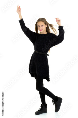 Pretty teenage long haired girl in black clothes