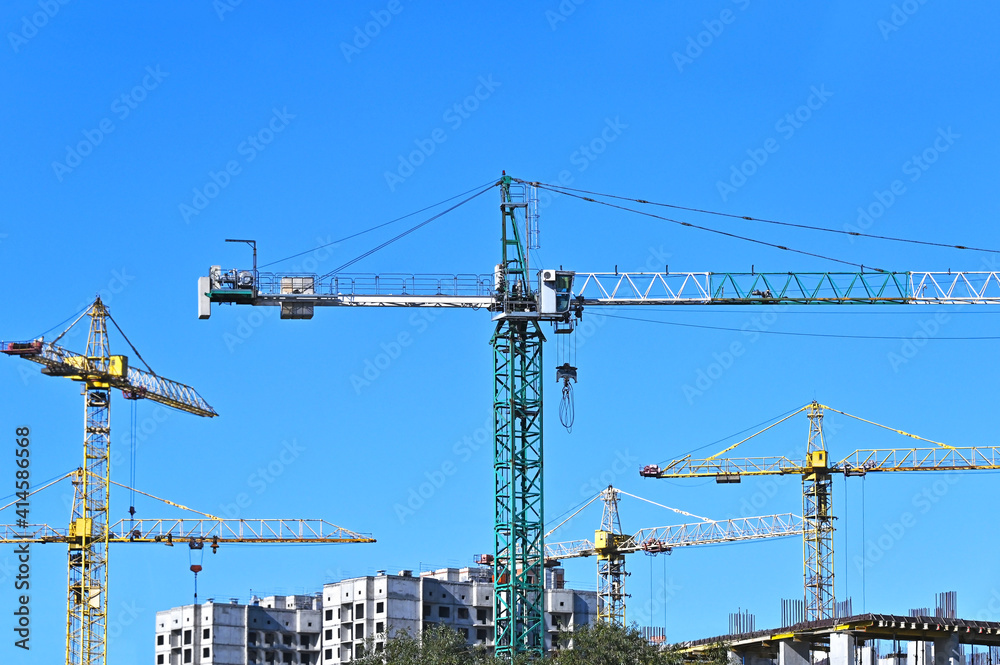 Crane and highrise construction site Crane and highrise construction site
