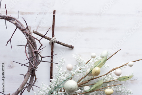 Crown of thorns, cross and easter eggs photo