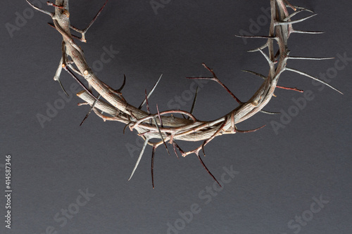 close up crown of thorns on black background photo
