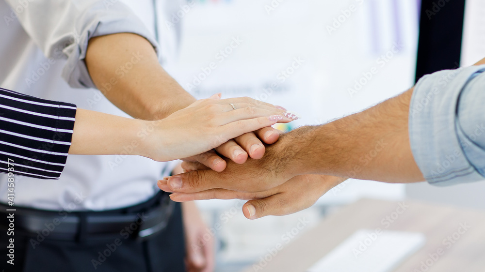 © Bangkok Click Studio - Close up hand. Teamwork Success. Business people group team happy showing teamwork and joining hands after meeting partner business in office.