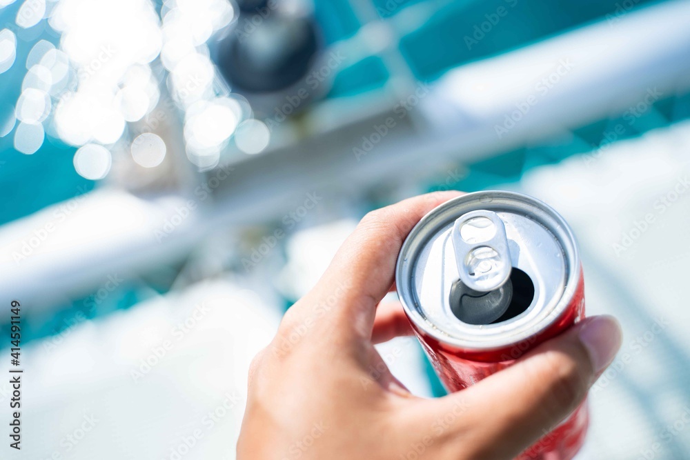 Fototapeta premium drinking canned soft drinks on the boat