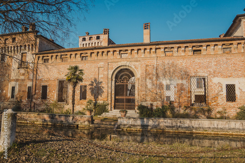 Castello di Padernello. The Padernello Castle feels like castle out of fairy tale, with its working drawbridge and encircling moat. It was built at the end of the 14th century by the Martinengo family photo