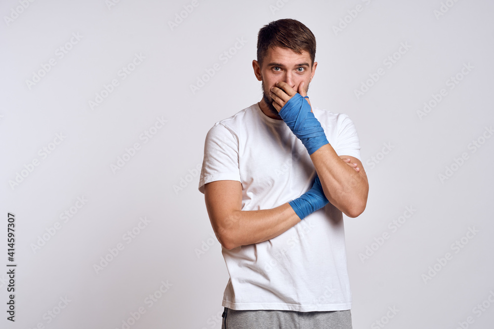 Sports man boxing bandages on hands emotions energy workout