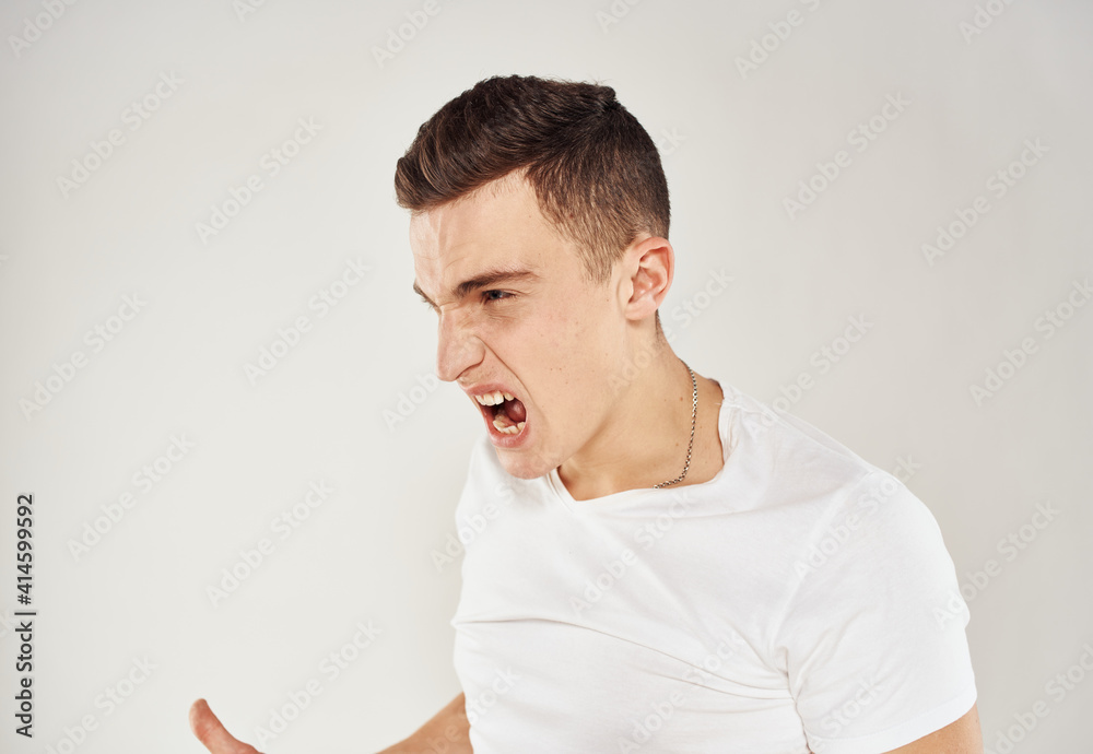 Inappropriate man gesturing with his hands on a light background cropped view close-up portrait Inappropriate man gesturing with his hands on a light background cropped view close-up portrait