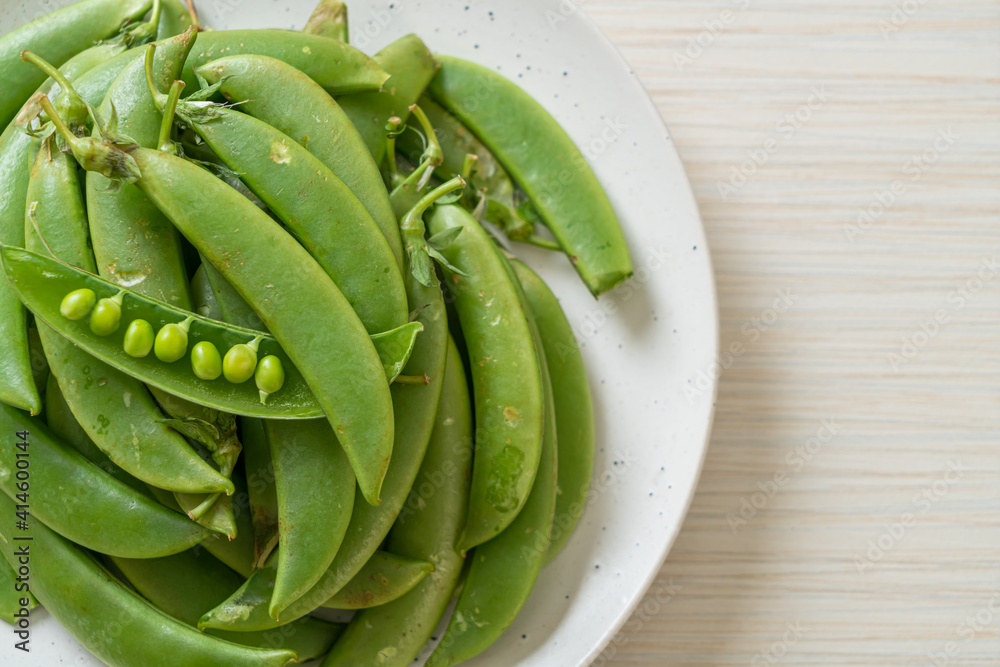 fresh sweet green peas on plate fresh sweet green peas on plate