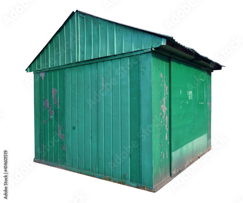 Small aged green metal shed barn isolated