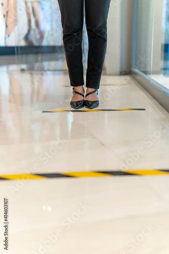 Cute Malay Girl at the mall going shopping wearing face mask