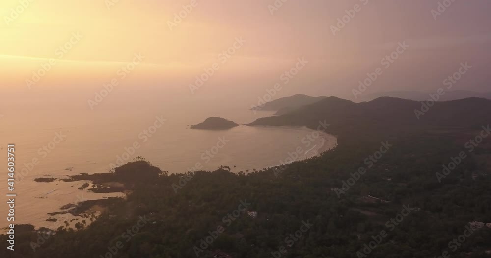 Paradise Island With Tranquil Ocean During Sunset At Patnem Beach In Canacona, South Goa, India. - Aerial Wide Shot Paradise Island With Tranquil Ocean During Sunset At Patnem Beach In Canacona, South Goa, India. - Aerial Wide Shot