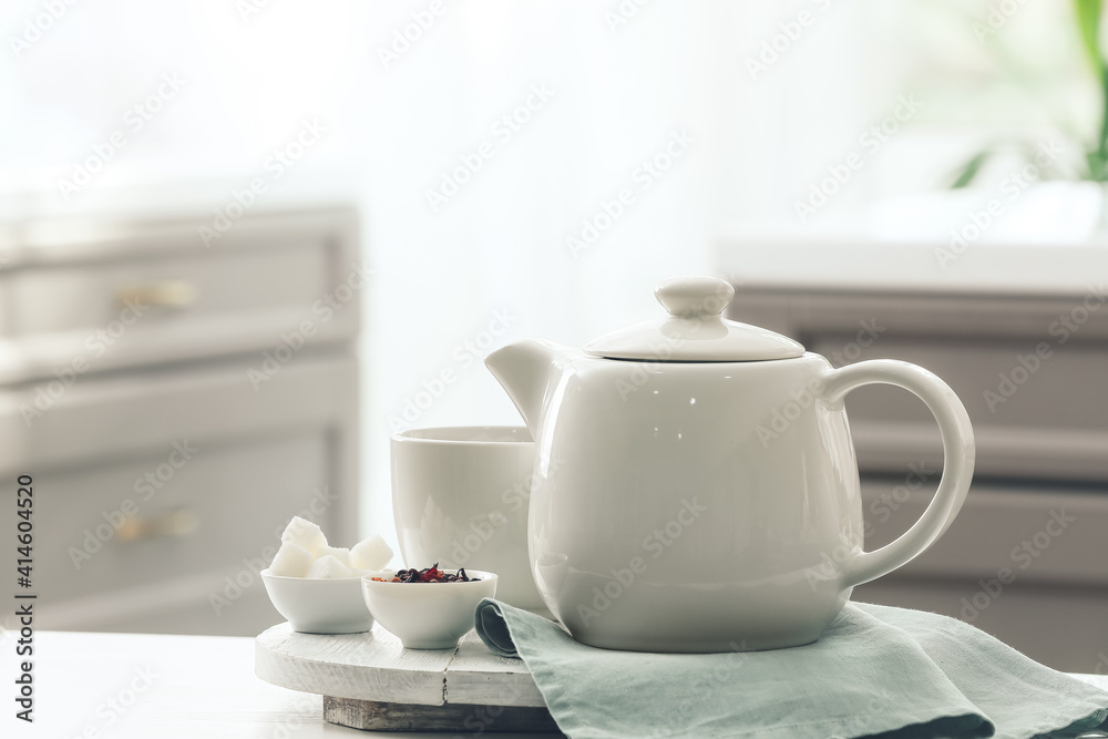 Tray with teapot and cup on table Tray with teapot and cup on table
