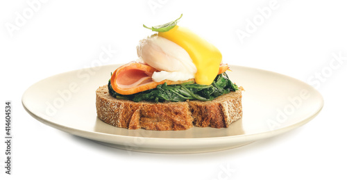 Fényképezés Plate of tasty sandwich with florentine egg on white background