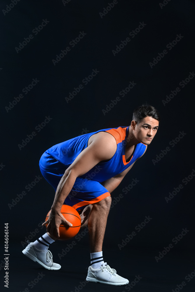 Male basketball player on dark background Male basketball player on dark background
