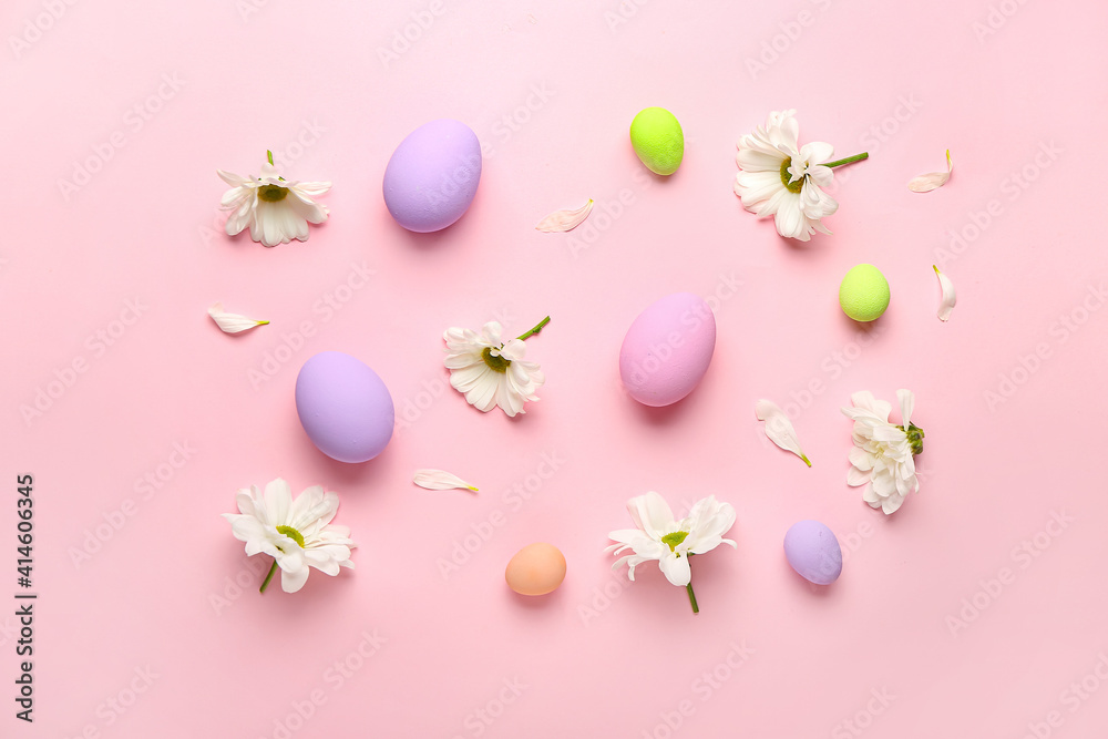Beautiful Easter composition with eggs and spring flowers on color background