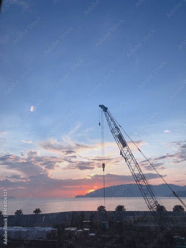 crane at sunset