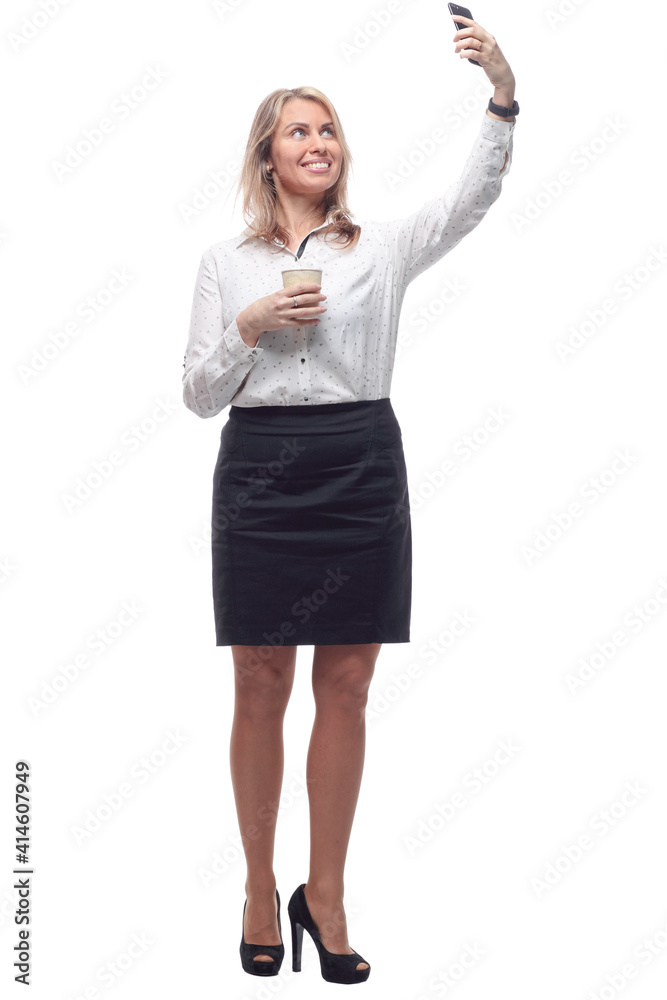 young woman in formal wear with takeaway coffee taking a selfie. young woman in formal wear with takeaway coffee taking a selfie.