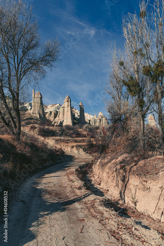 trail in the desert of cappadocia with rock formations of the love valley