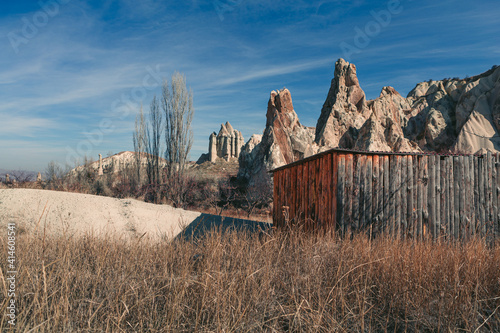 cabin in the desert of capadoccia with rock formations in the background