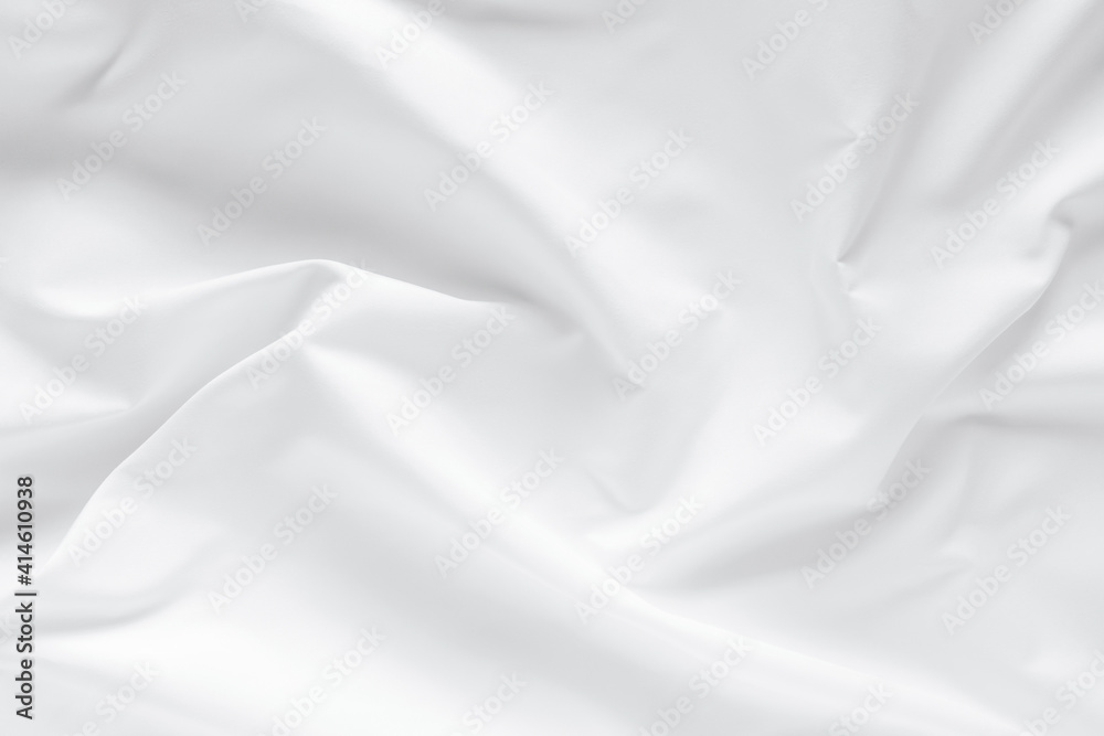 Abstract white fabric texture background. Cloth soft wave. Creases of satin. silk and cotton.