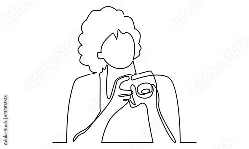 Continue line of woman holding digital camera