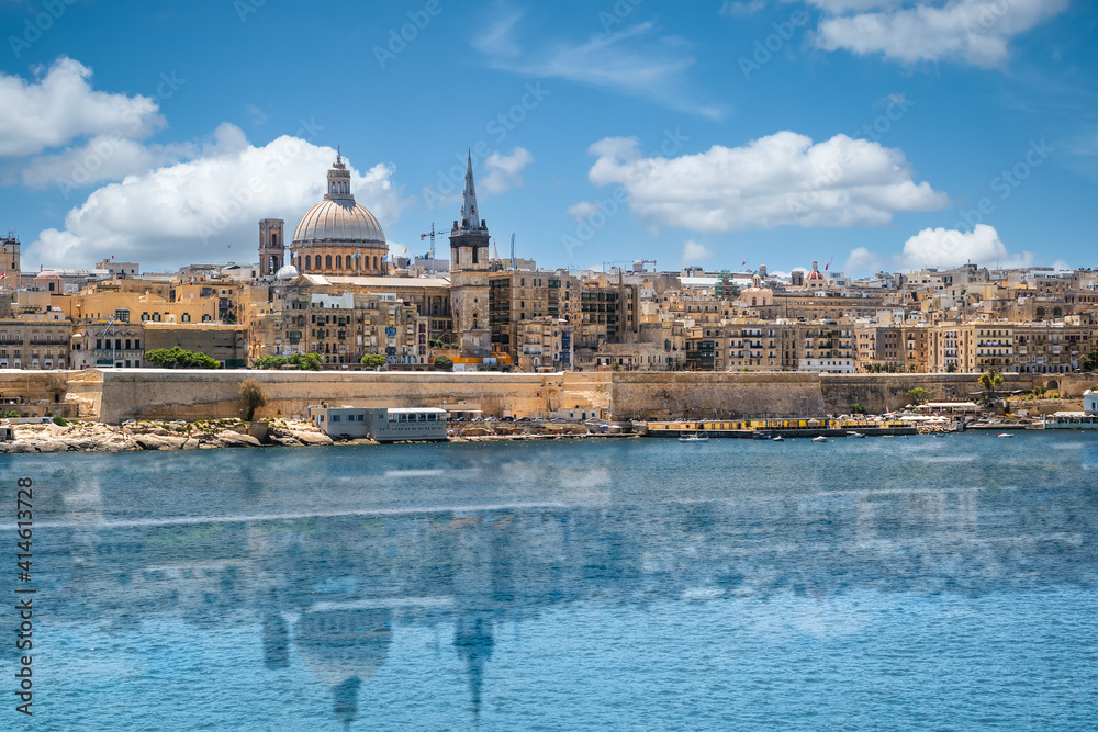 Valletta, Malta city skyline with reflection in water.