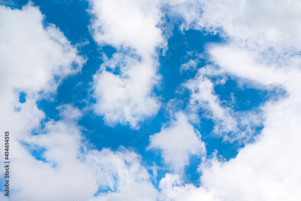 White clouds on bright blue sky and space background White clouds on bright blue sky and space background