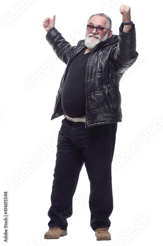 contented bearded man in a black jacket giving a thumbs up.