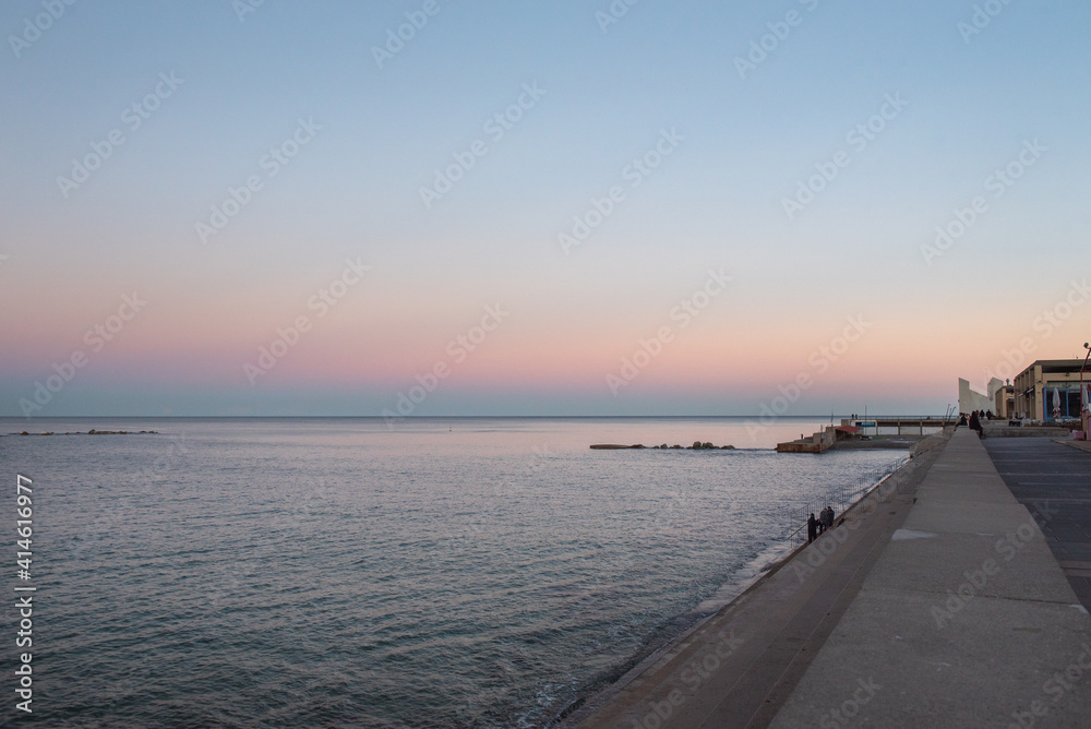 Sunset in Nova Icaria Beach in the Barcelona area on the Mediterranean on winter 2021