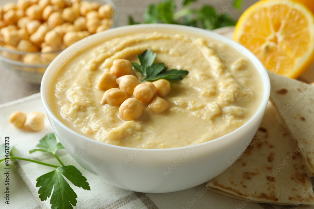 Concept of tasty eat with bowl of hummus, close up
