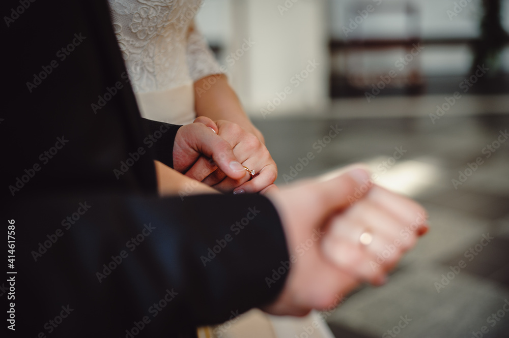 Happy married couple holding hands, close up.