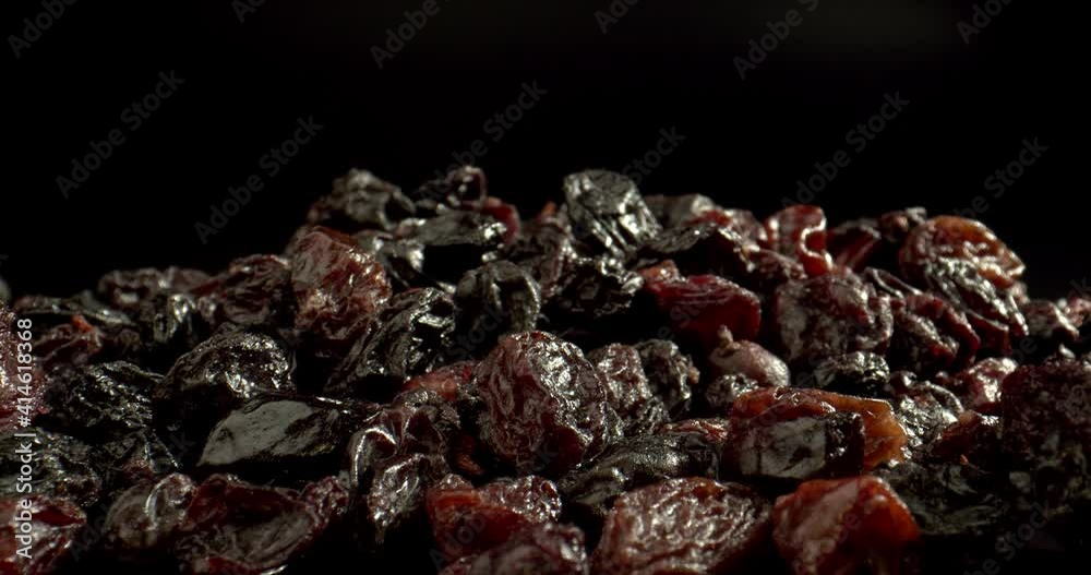 Concept of concentrated sources of energy, electrolytes, vitamins and minerals. Raisin close-up. Dried grapes on black background. High quality. Concept of concentrated sources of energy, electrolytes, vitamins and minerals. Raisin close-up. Dried grapes on black background. High quality.