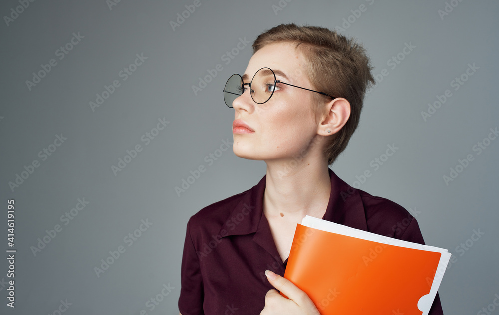 Woman secretary documents in hands of glasses short hairstyle business woman Woman secretary documents in hands of glasses short hairstyle business woman