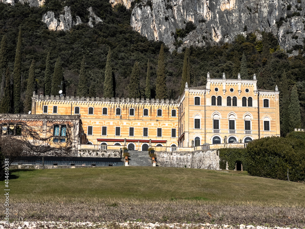 Pleasant view of the coast of Lake Garda. A romantic walk in the town of Garda which gives its name to the lake during a sunny day.