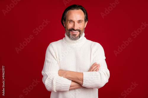 Portrait of satisfied guy toothy smile folded arms wear knitted pullover isolated on maroon color background