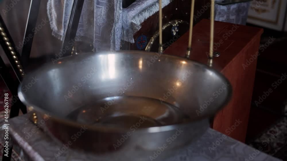 basin in the church for the baptism of children with water basin in the church for the baptism of children with water