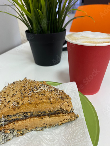 A piace of cake with coffee late in a cafe 