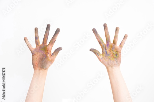 paint stained hands on white background