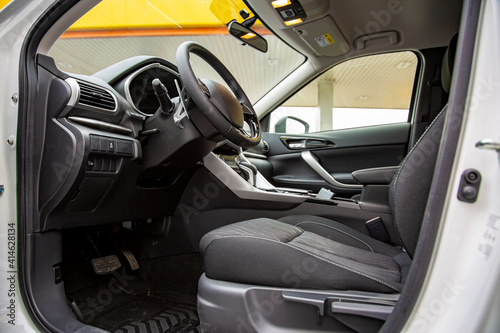 empty interior of modern premium car. black interior, driver's seat