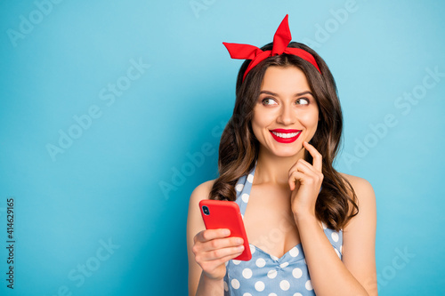 Close-up portrait of her she nice attractive lovely pretty glamorous curious cheerful wavy-haired girl creating new post smm feedback isolated on bright vivid shine vibrant blue color background