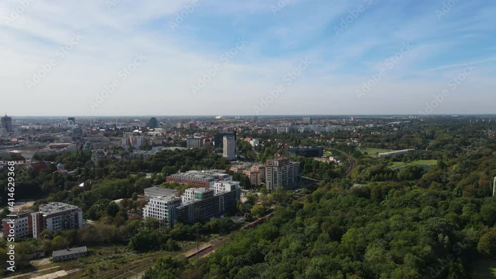 Poznan view from park Cytadela. City Poznan, Poland with Cytadela park in the foreground. Concept of living near the nature. Forest in front of the town. Poznan view from park Cytadela. City Poznan, Poland with Cytadela park in the foreground. Concept of living near the nature. Forest in front of the town.