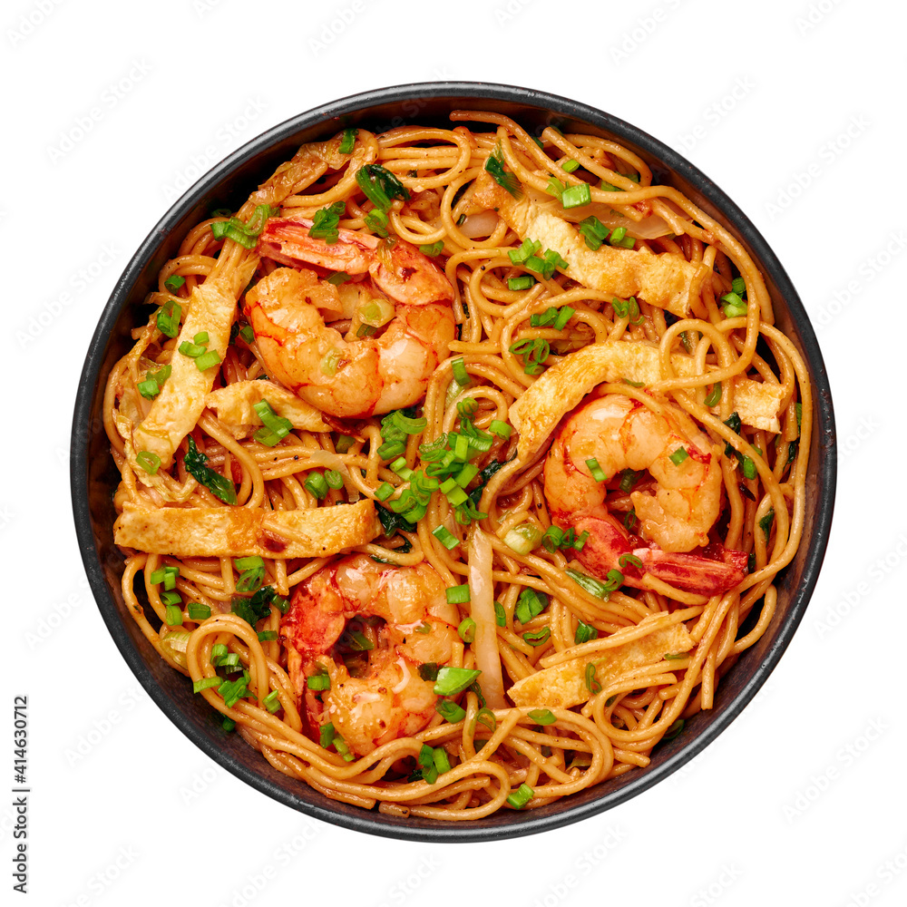 Mie Goreng in black bowl isolated on white. Indonesian cuisine prawn noodles and vegetables stir fired dish. Asian food. Mie Goreng in black bowl isolated on white. Indonesian cuisine prawn noodles and vegetables stir fired dish. Asian food.