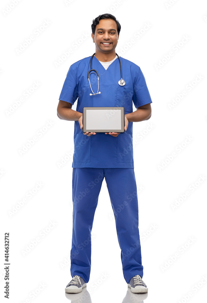 medicine, healthcare and technology concept - happy smiling indian doctor or male nurse in blue uniform with stethoscope showing tablet pc computer over white background medicine, healthcare and technology concept - happy smiling indian doctor or male nurse in blue uniform with stethoscope showing tablet pc computer over white background