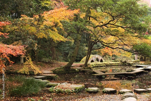 View of bright red and yellow autumn leaves and Japanese garden in Kanazawa, Ishikawa prefecture, Japan - 金沢 尾山神社 秋のもみじ 石川県 日本