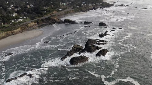 Rising cinematic aerial, Seal Rock in North Pacific Ocean photo